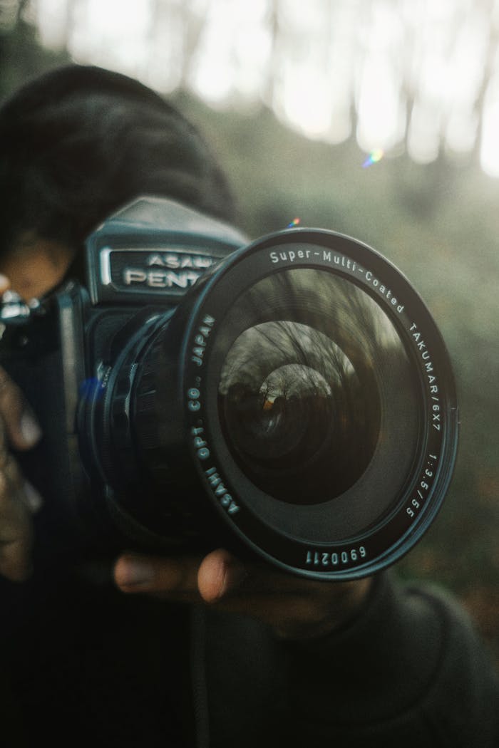 Man Holding Digital Camera